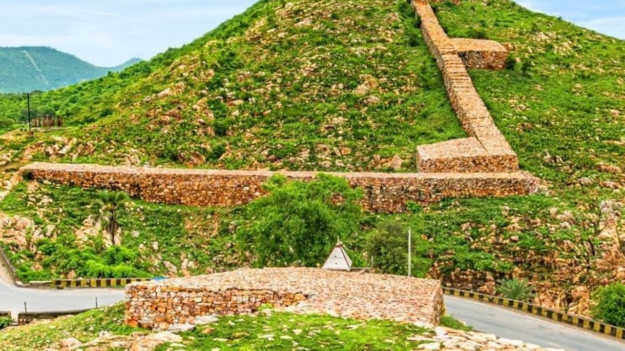 The 40-km long Cyclopean Wall of Rajgir is believed to have been built in the pre-Mauryan era, using massive undressed stones. Credit: Twitter/@TourismBiharGov