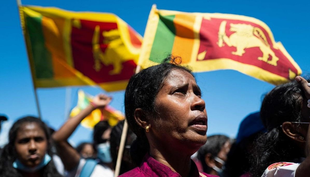 People shout slogans during an ongoing anti-government demonstration outside the president's office in Colombo on April 15, 2022, demanding the resignation of President Gotabaya Rajapaksa over the country's crippling economic crisis. (Photo: Jewel SAMAD / AFP)