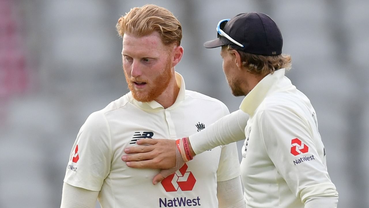Ben Stokes (L) interacts with Joe Root during a Test match. Credit: Reuters File Photo