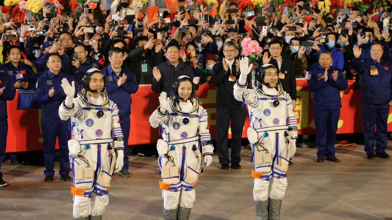The three astronauts pictured prior to their departure. Credit: AFP File Photo
