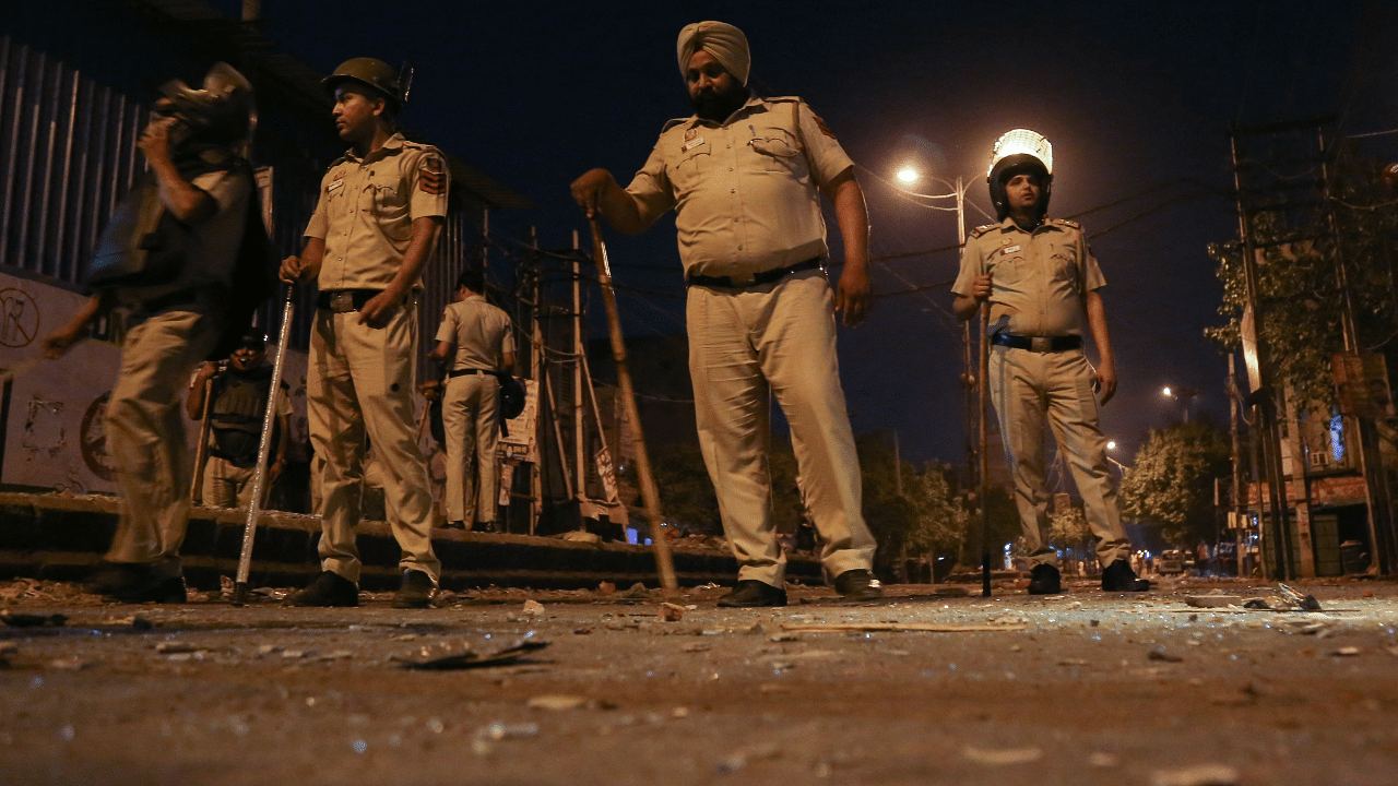 Police personnel stand guard in a residential area of Jahangirpuri, in New Delhi. Credit: AFP Photo