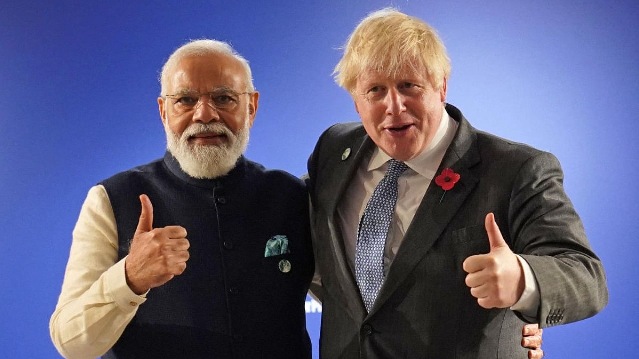 Britain's Prime Minister Boris Johnson (R) and India's Prime Minister Narendra Modi. Credit: AFP Photo