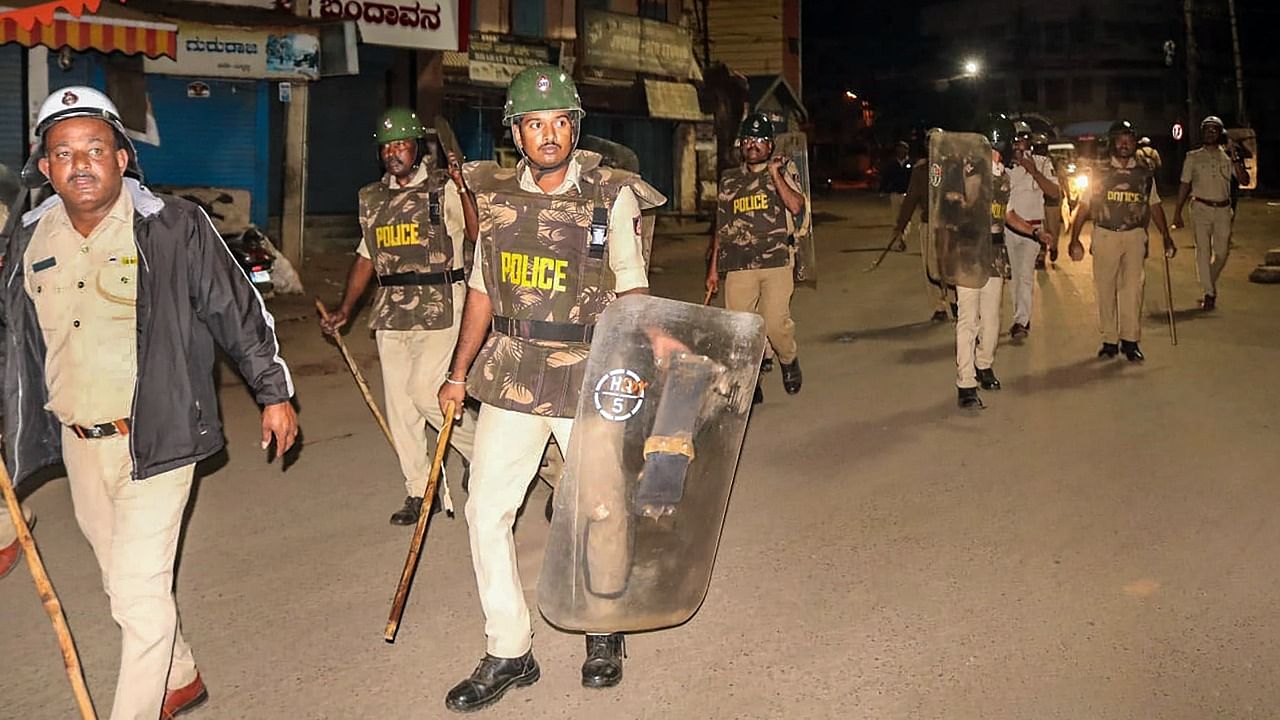 Security personnel maintain law and order after incidents of stone throwing in some areas of Old Hubballi late on Saturday evening, in Hubballi district. Credit: PTI Photo