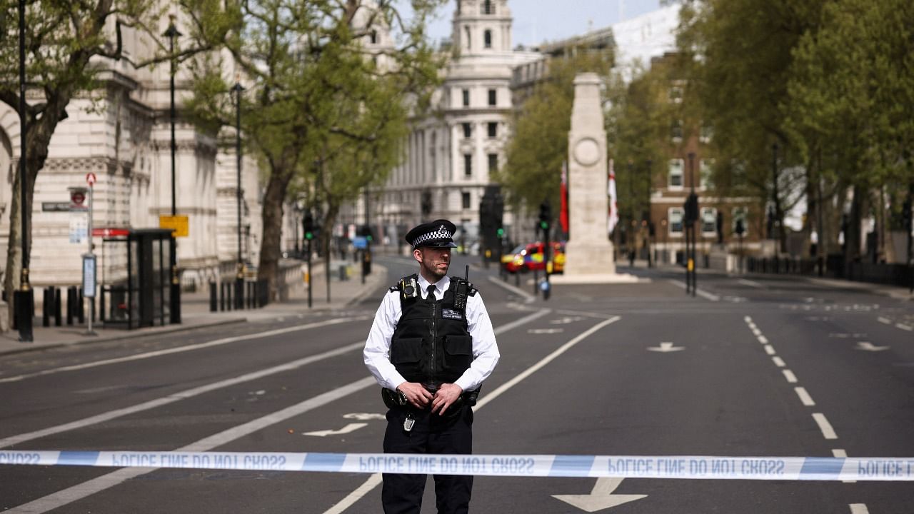 A police officer stands at a cordon on Whitehall in Westminster after the road was closed following an incident involving the arrest of a man near Downing Street, in London. Credit: Reuters File Photo