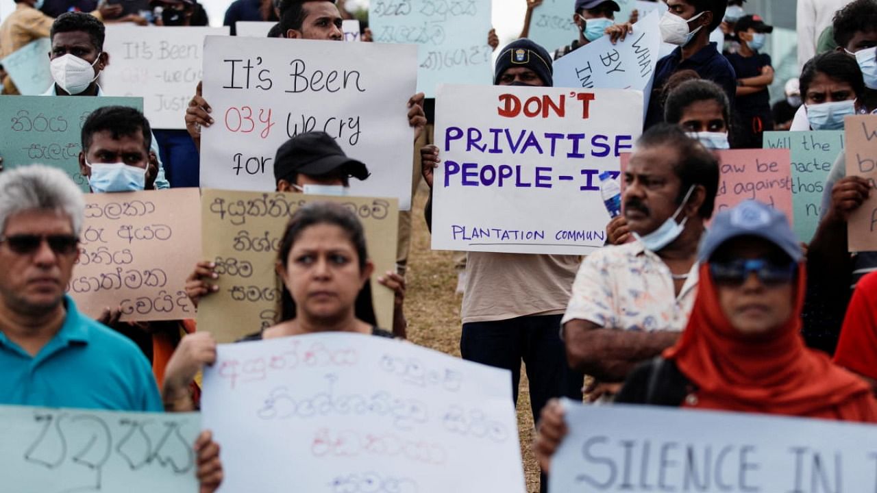 Demonstrators holding placards attend a protest to demand justice for the April 2019 Easter Sunday bomb attack, on the third anniversary of this attack, near the Presidential Secretariat, amid the country's economic crisis, in Colombo. Credit: Reuters Photo