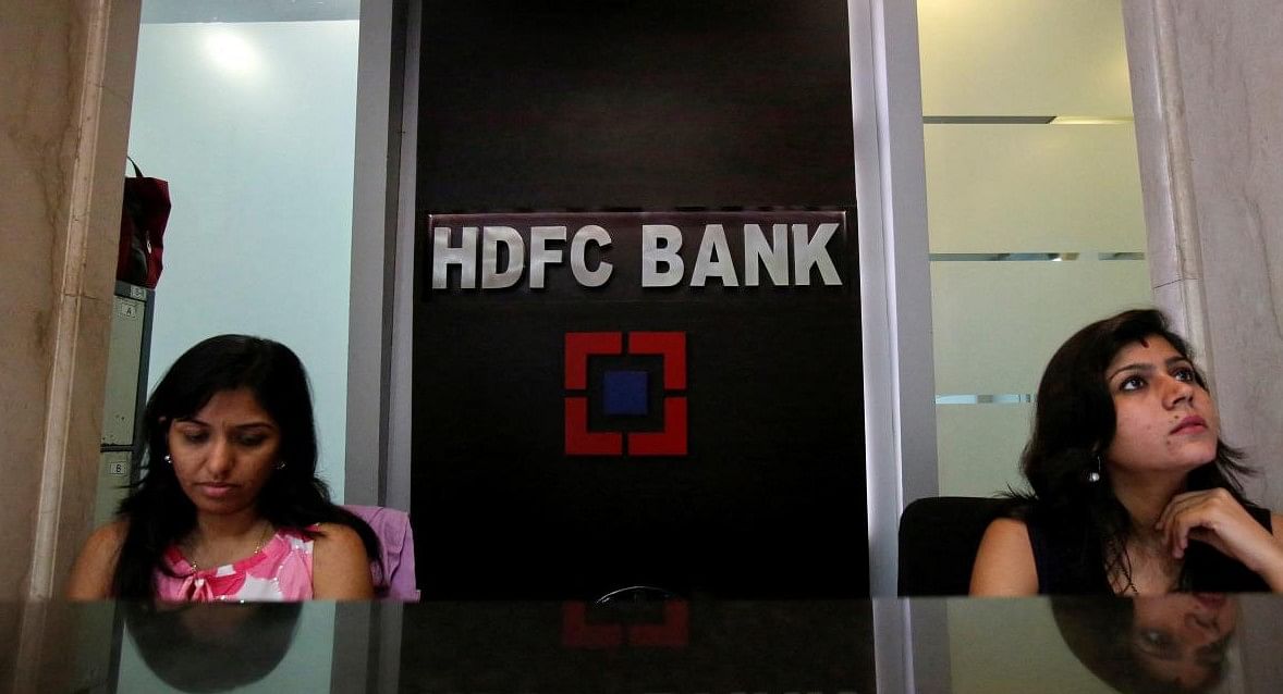 FILE PHOTO: Personal bankers wait for customers at the reception of a HDFC Bank branch in Mumbai. Credit: Reuters