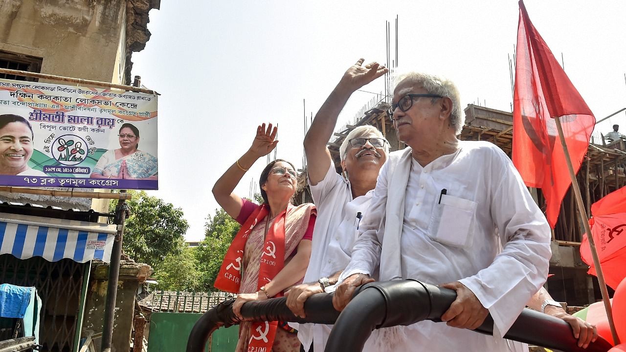 Biman Bose(R) and party leader Sujan Chakraborty (C) during a campaign in 2019. Credit: PTI File Photo