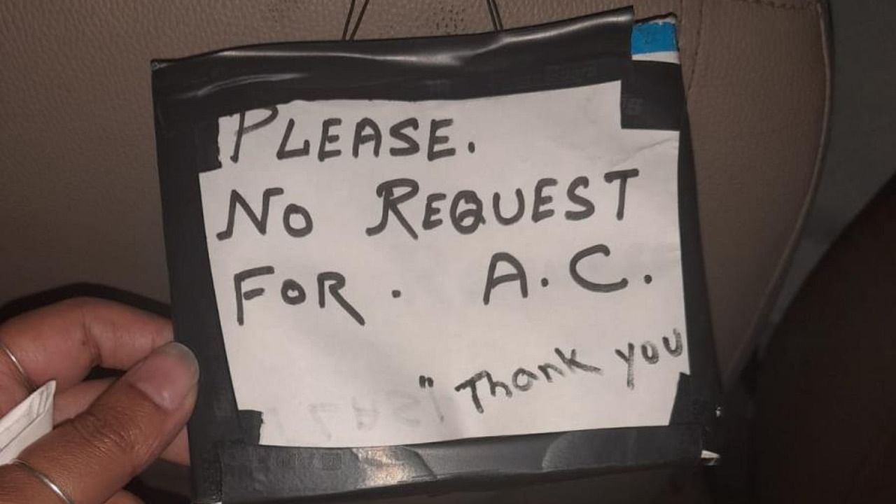 A message written by a cab driver asking people to not request AC during the ride. Credit: Special arrangement