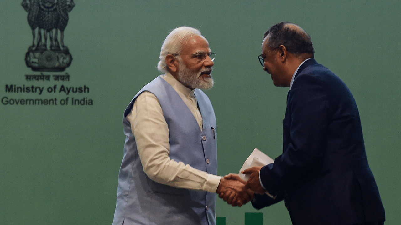 Narendra Modi (L) shakes hand with Director-General of the World Health Organization (WHO) Tedros Adhanom Ghebreyesus. Credit: PTI Photo