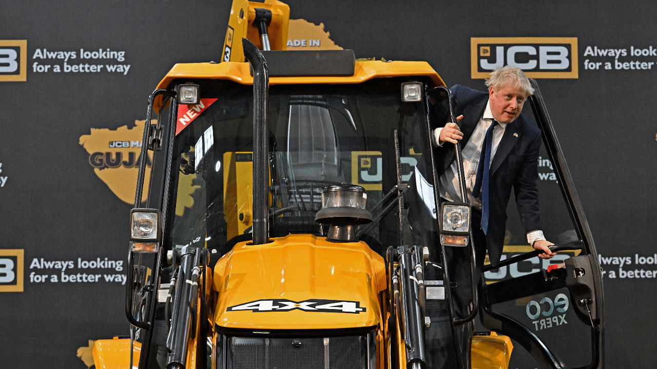Johnson visited the JCB factory accompanied by Gujarat Chief Minister Bhupendra Patel. Credit: Reuters Photo