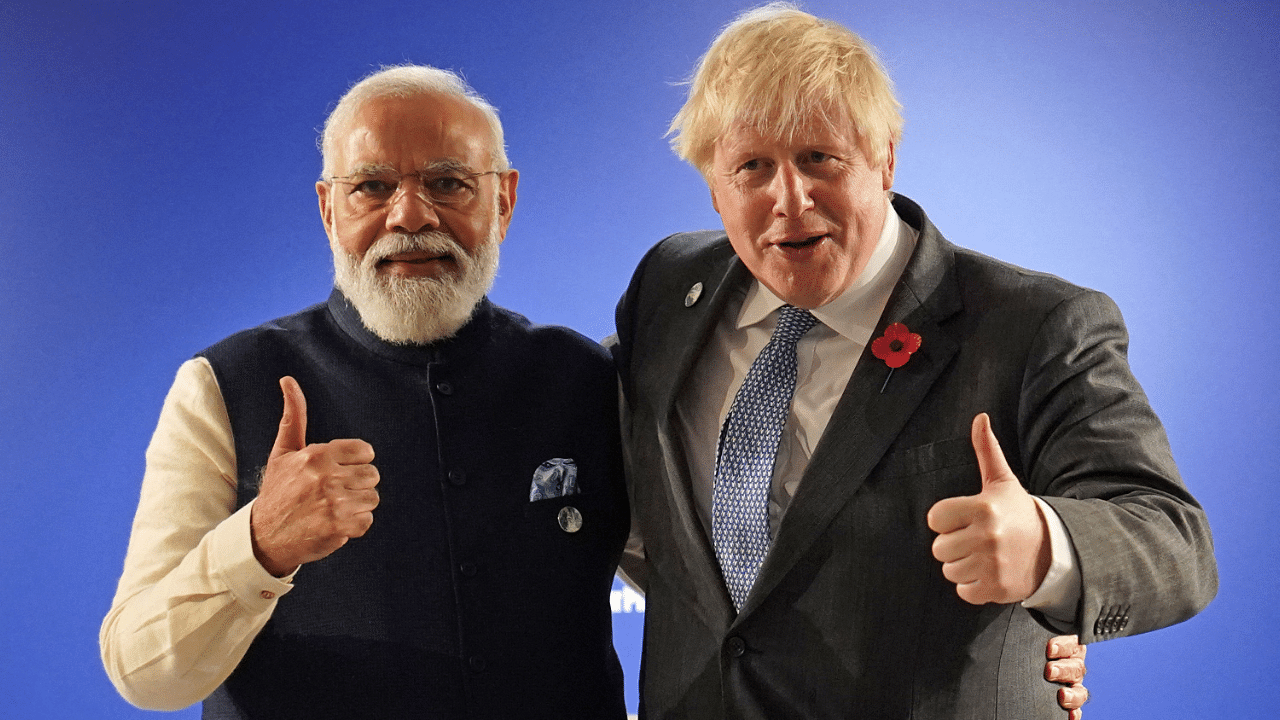 Britain's Prime Minister Boris Johnson (R) and India's Prime Minister Narendra Modi. Credit: AFP Photo