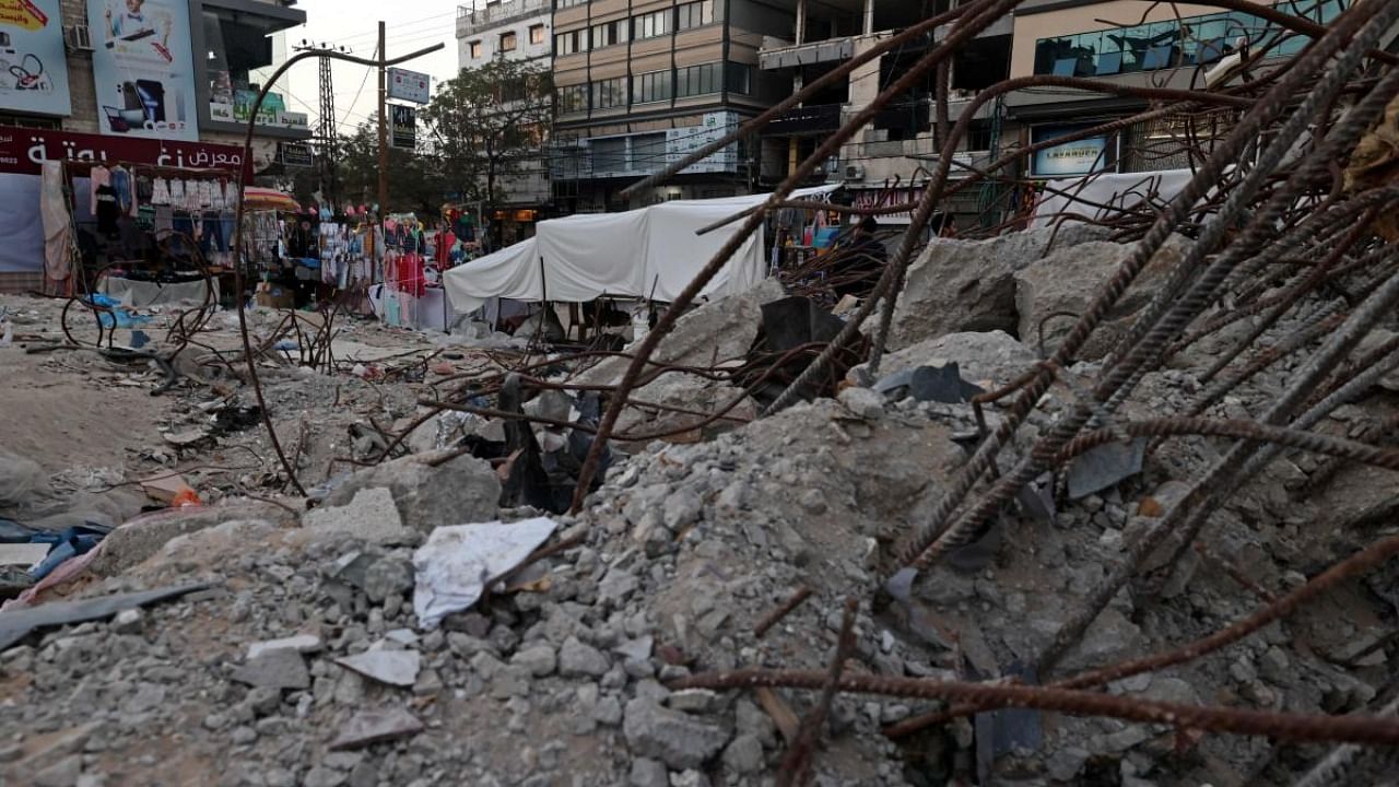 A partial view shows the remains of the Shorouq building, levelled by an Israeli air strike during the May 2021 conflict between Israel and Hamas, in Gaza City on April 19, 2022. Credit: AFP Photo