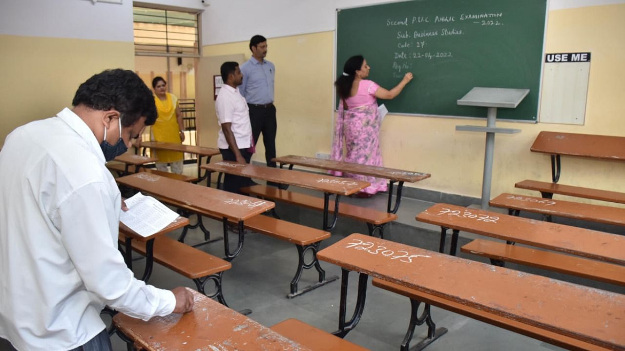 Preparations are on for the II PU exams at a classroom at Seshadripuram Composite PU College in Bengaluru on Thursday. Credit: Special arrangement
