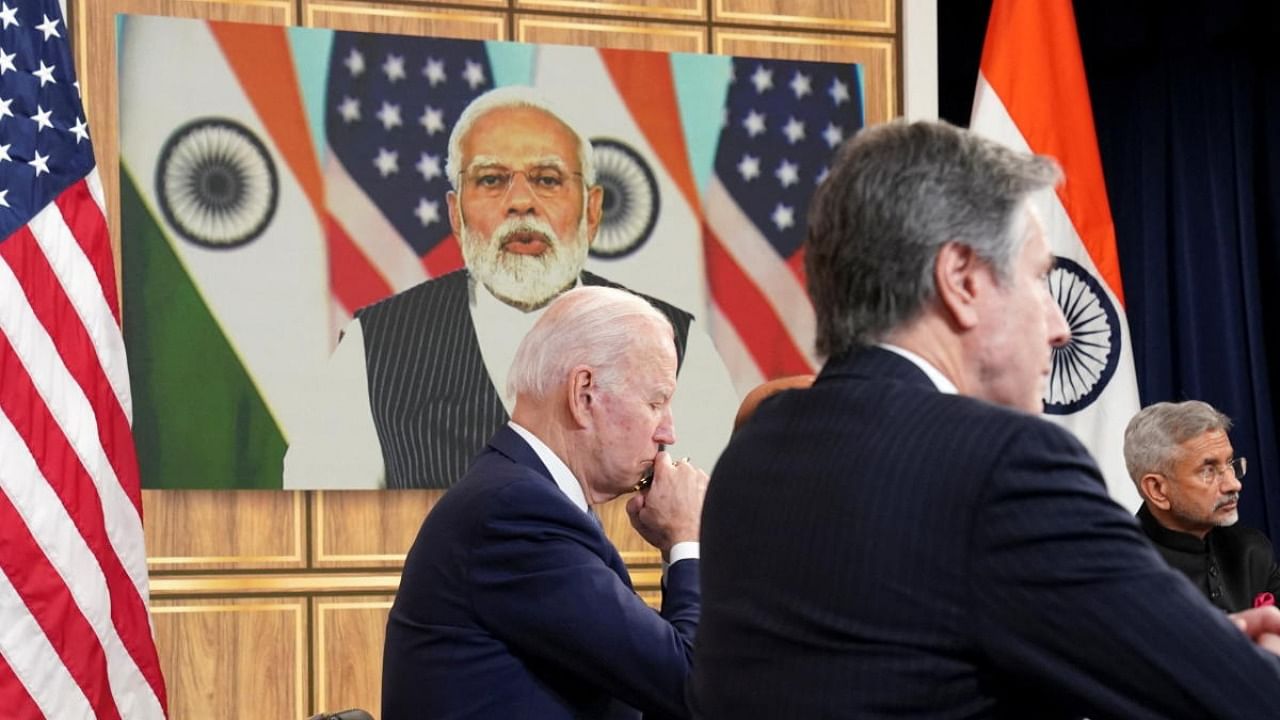 US President Joe Biden, seated with Secretary of State Antony Blinken and EAM S Jaishankar, holds a videoconference with Prime Minister Narendra Modi. Credit: Reuters photo