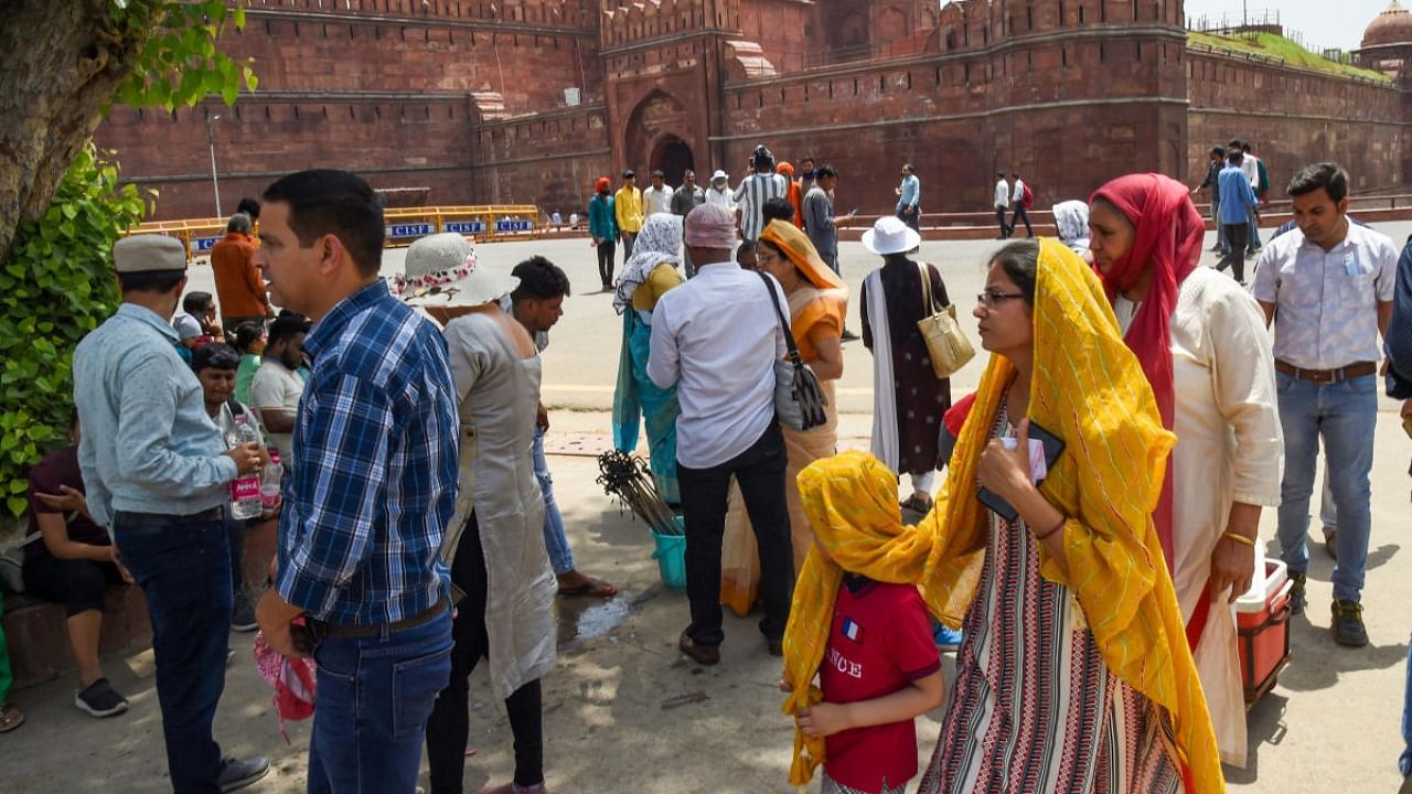 Tourists visit the historic Red Fort on a hot summer day, amid a slight surge in coronavirus cases, in New Delhi. Credit: PTI Photo