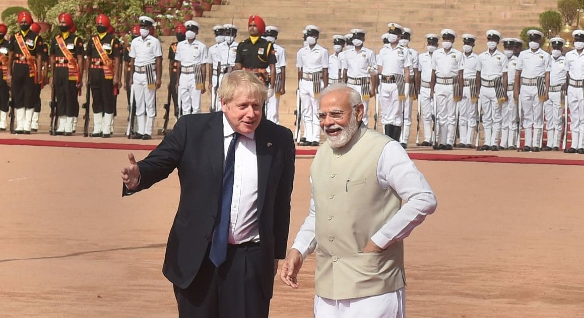 Prime Minister Narendra Modi with British Prime Minister Boris Johnson during the latter's ceremonial reception at Rashtrapati Bhavan in New Delhi, Friday, April 22, 2022. (PTI Photo/ Manvender Vashist)