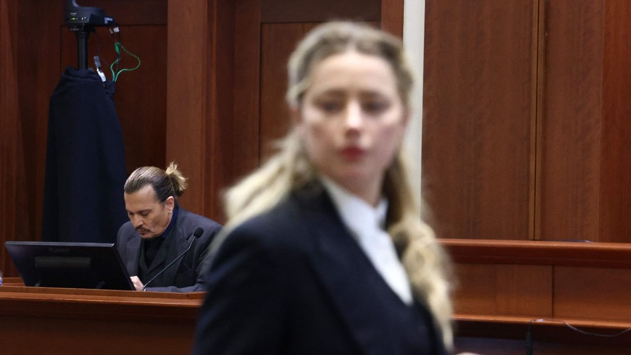 Amber Heard and Johnny Depp during their trial. Credit: AFP Photo