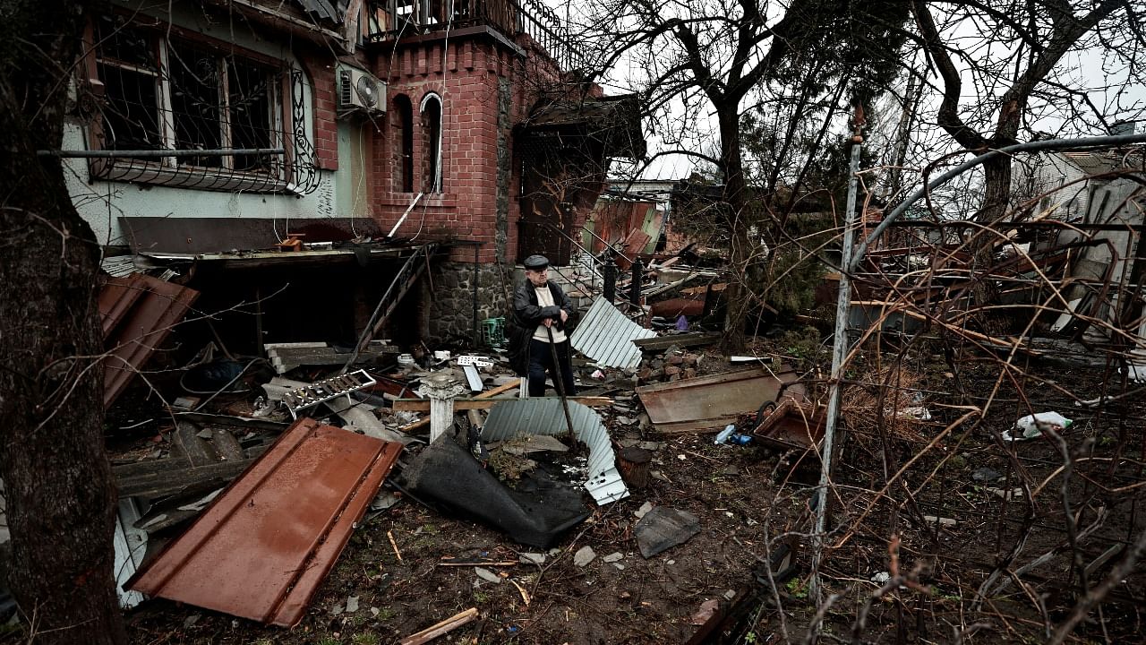 Volodymyr Mitenkov, 72, sits a the cortyard of his house that was destroyed by Russian shelling, amid Russia's Invasion of Ukraine in Chernihiv. Credit: Reuters Photo