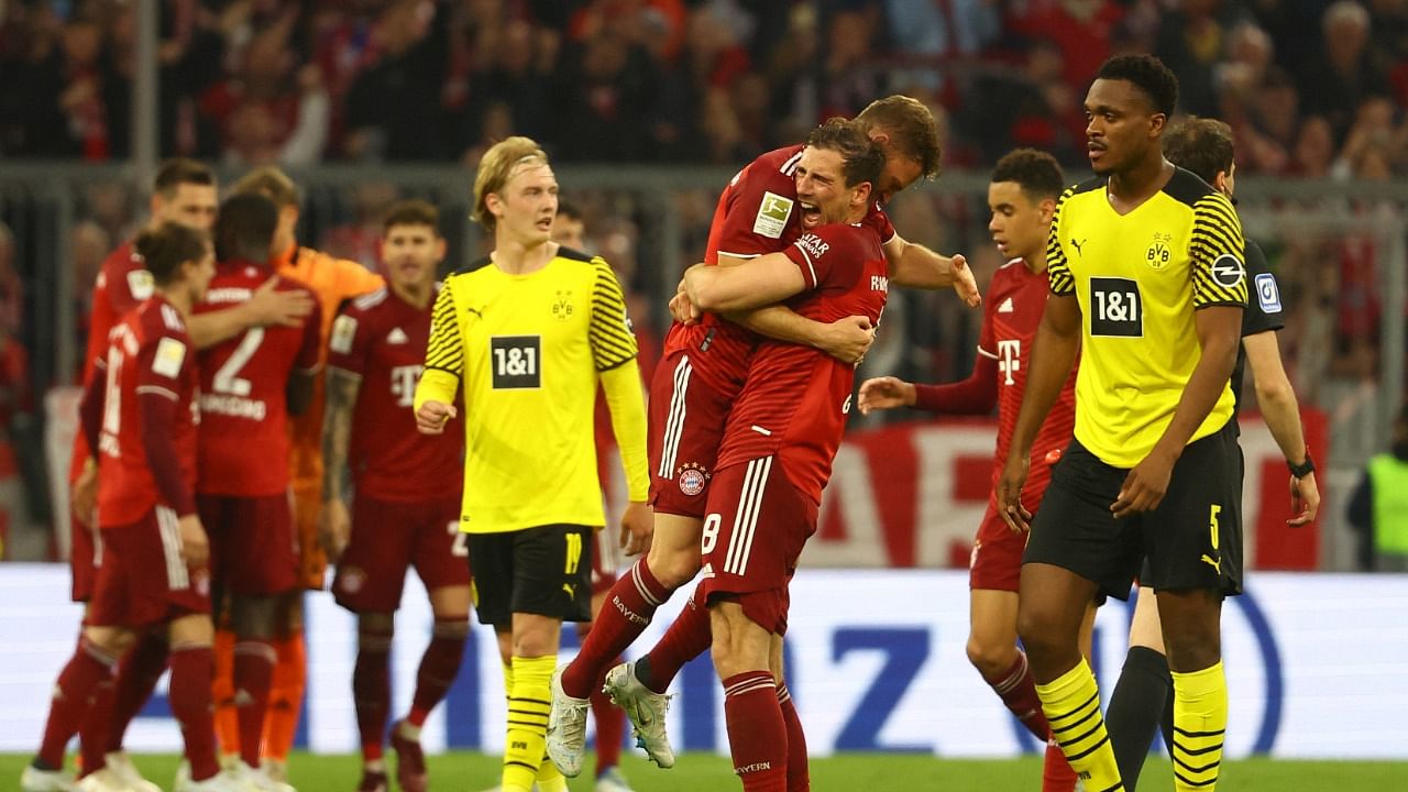 Bayern Munich's Leon Goretzka celebrates with Joshua Kimmich after winning the Bundesliga. Credit: Reuters Photo