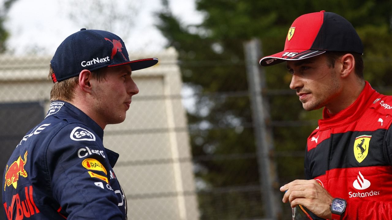 Red Bull's Max Verstappen (L) with Ferrari's Charles Leclerc after the Imola GP Sprint race. Credit: AFP Photo