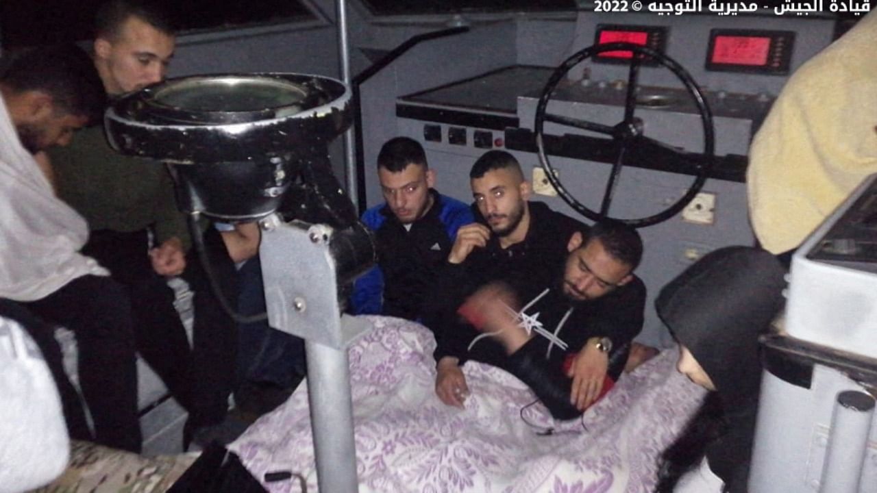 Survivors of a capsized boat on board an army boat after they were rescued off the coast of the northern Lebanese city of Tripoli. Credit: AFP Photo