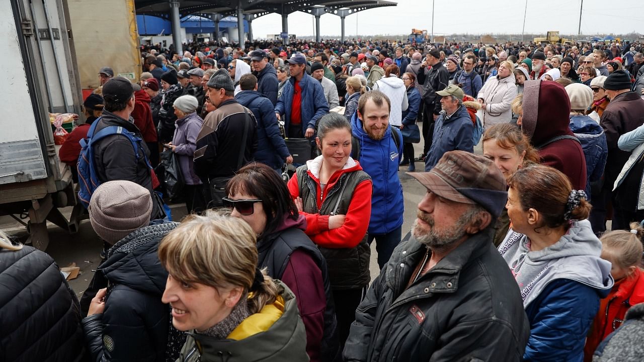 Local civilians gather to get humanitarian aid distributed by Donetsk People Republic Emergency Situations Ministry in an area controlled by Russian. Credit: AP Photo