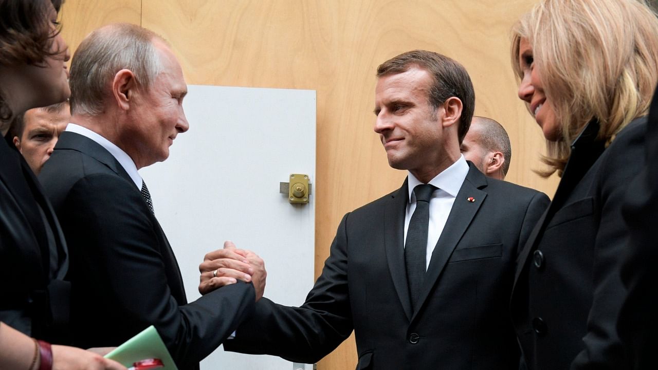 Vladimir Putin and Emmanuel Macron. Credit: AFP File Photo