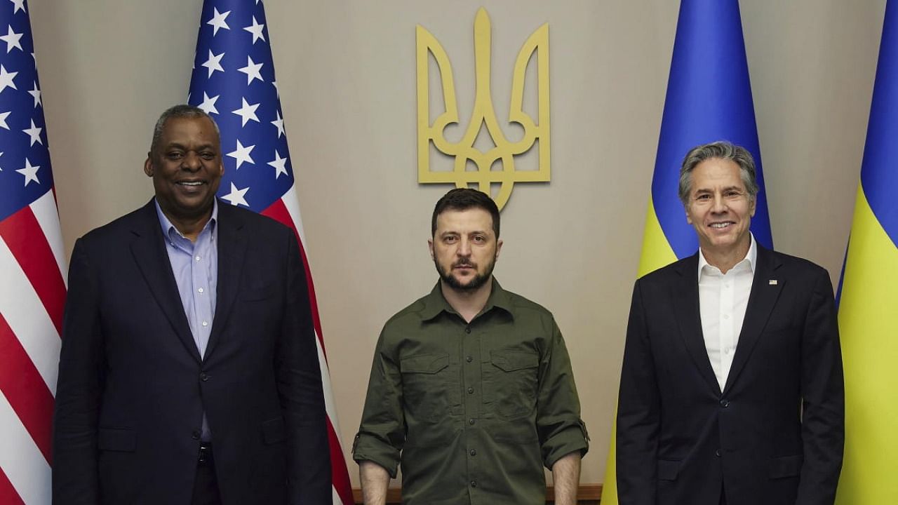 In this image from video provided by the Ukrainian Presidential Press Office on Monday, April 25, 2022, from left; U.S. Secretary of Defense Lloyd Austin, Ukrainian President Volodymyr Zelenskyy and U.S. Secretary of State Antony Blinken pose for a picture during their meeting in Kyiv, Ukraine. Credit: AP/PTI Photo