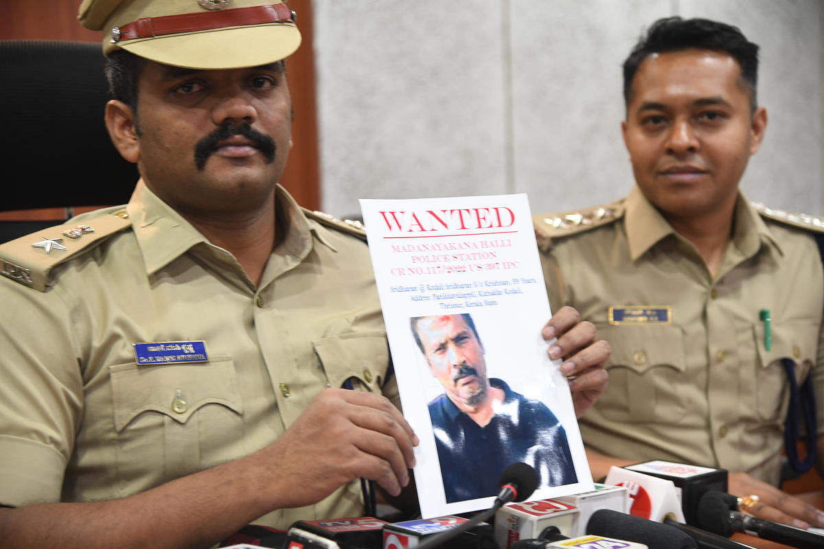 Bengaluru Rural SP K Vamsi Krishna shows a picture of gangster Kodali Sreedharan at a press conference on Monday. Credit: DH Photo/B H Shivakumar