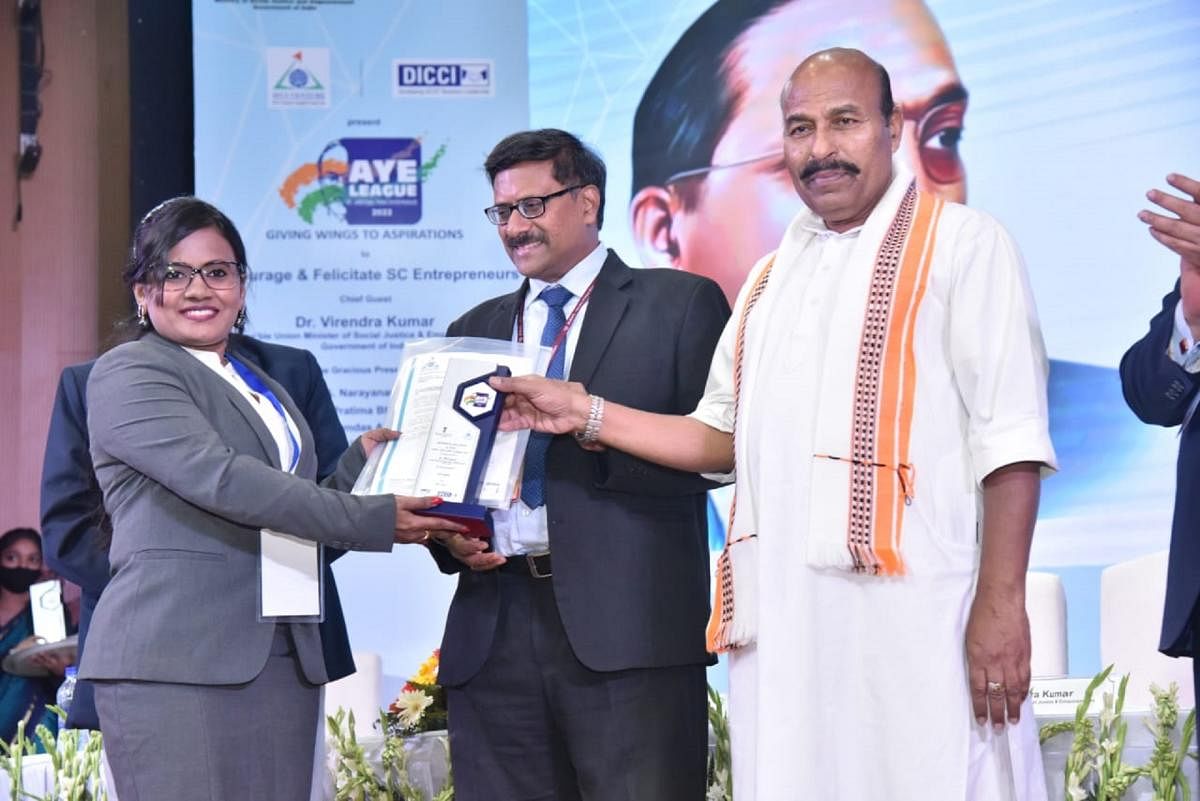 Panchami H R, a research scholar at the National Institute of Technology-Karnataka (NITK), is felicitated by Union Minister of Social Justice and Empowerment Dr Virendra Kumar in New Delhi.