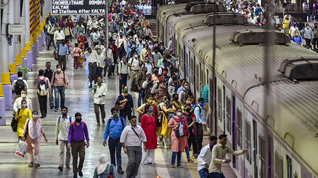 Commuters board Mumbai local. Credit: PTI File Photo