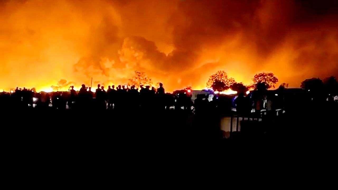 Smoke billows from a fire at a garbage mound in Gurugram’s Manesar on Monday night. Credit: PTI Photo