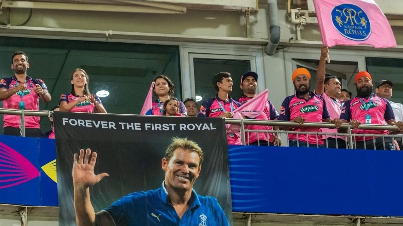 RR fans display a banner dedicated to the late legendary cricketer Shane Warne during an IPL 2022 match. Credit: IANS Photo