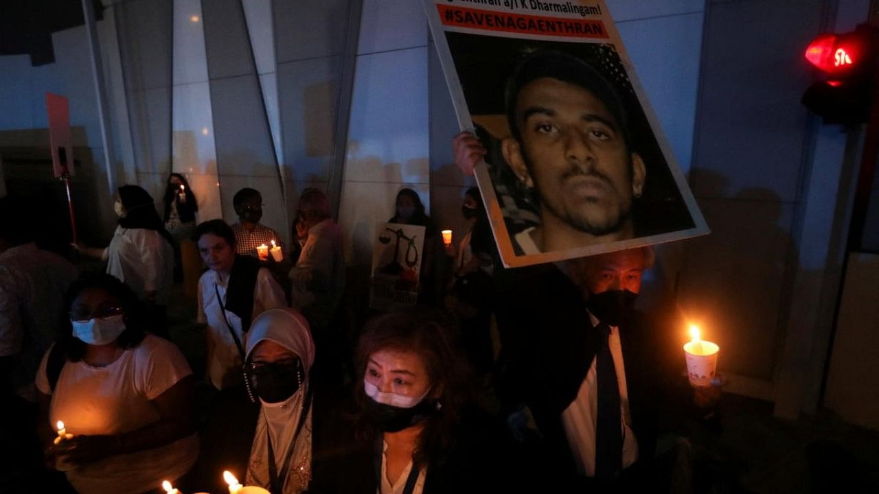 People take part in a vigil ahead of the planned execution of Malaysian drug trafficker, Nagaenthran Dharmalingam, outside Singapore High Commission in Kuala Lumpur. Credit: Reuters Photo