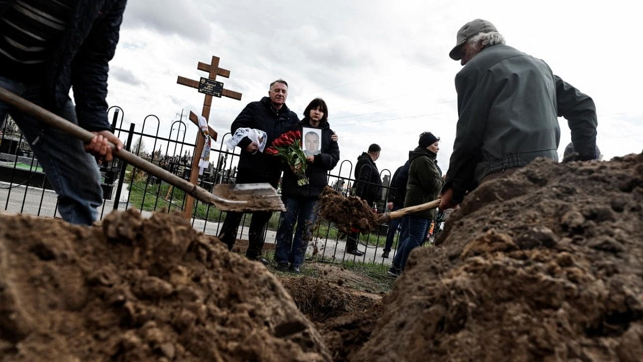 Satellite images would later show that several bodies had been lying in the street since mid-March, when the town was under Russian control. Credit: Reuters Photo
