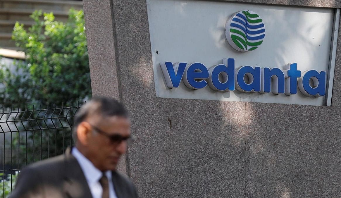 A man walks past the logo of Vedanta outside its headquarters in Mumbai. Credit: Reuters photo