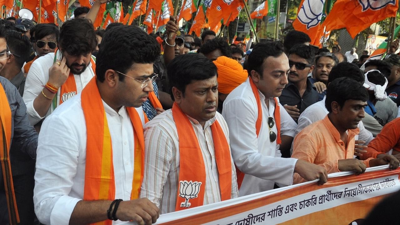 BJYM National President Tejasvi Surya, BJP State President Sukanta Majumdar with party workers during their 'Bikash Bhawan Abhiyan' against West Bengal Government over teacher recruitment scam and other issues, at Salt Lake in Kolkata. Credit: IANS Photo