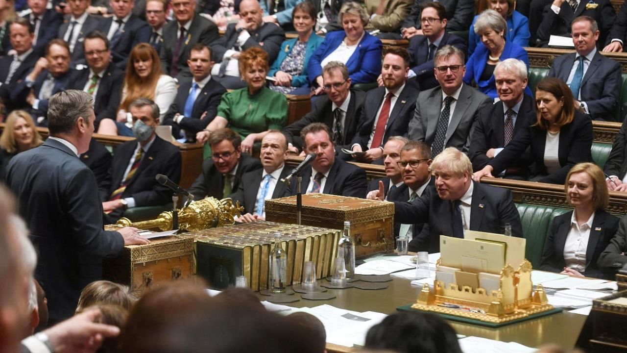 British Prime Minister Boris Johnson gestures as Labour Party opposition leader Keir Starmer speaks during Prime Minister's Questions at the House of Commons in London. Credit: Reuters file photo