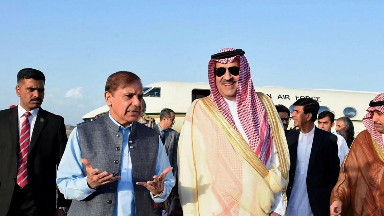 Emir of Medina Prince Faisal bin Salman bin Abdulaziz (R) welcomes Pakistani Prime Minister Shehbaz Sharif in the Saudi holy city. Credit: AFP Photo/Handout/SPA