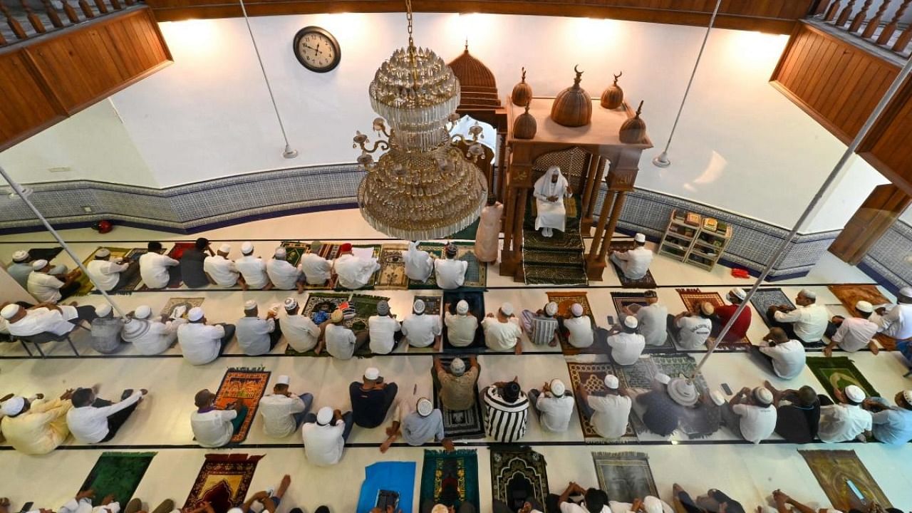 Muslim devotees offer the last Friday prayers of the holy fasting month of Ramadan at the Jumma Mosque in Colombo. Credit: AFP Photo