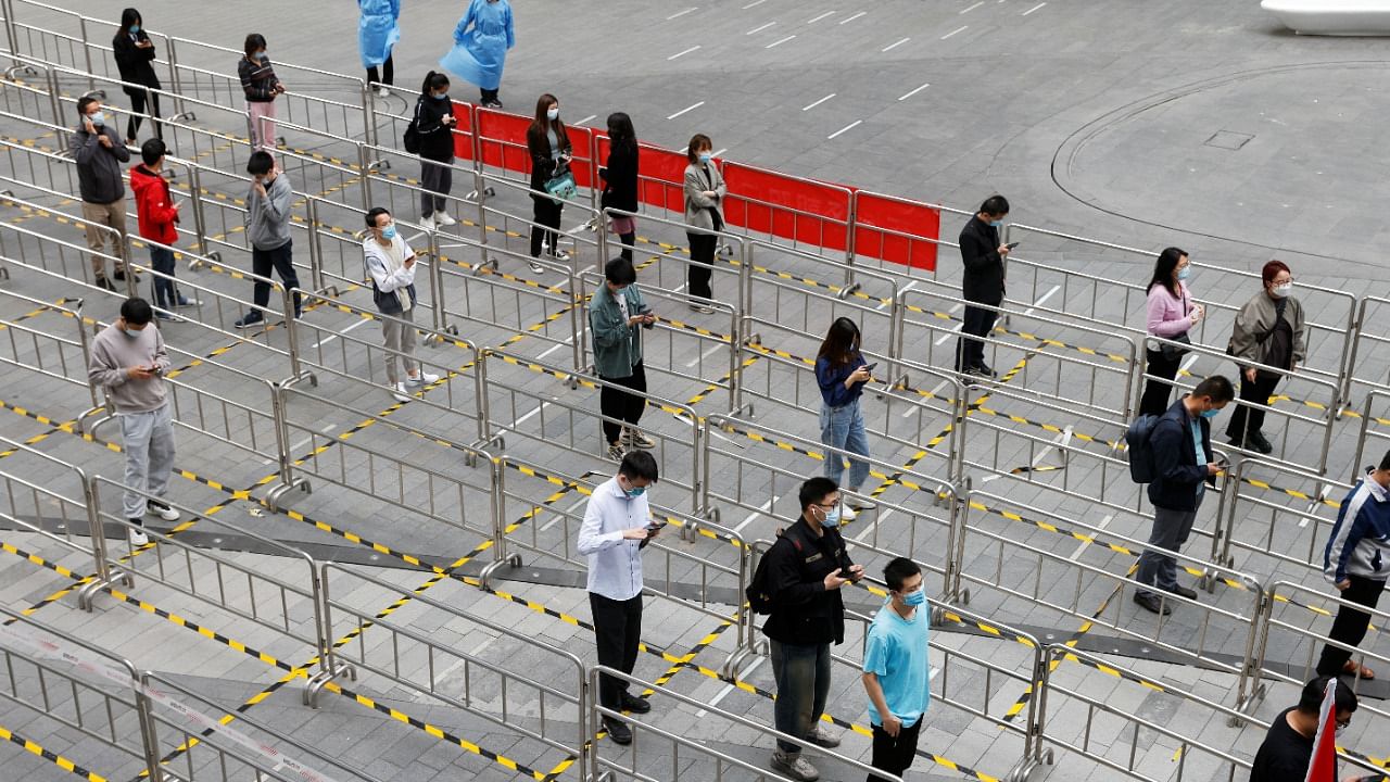 People line up at a makeshift nucleic acid testing site amid the coronavirus disease outbreak in Beijing. Credit: Reuters Photo