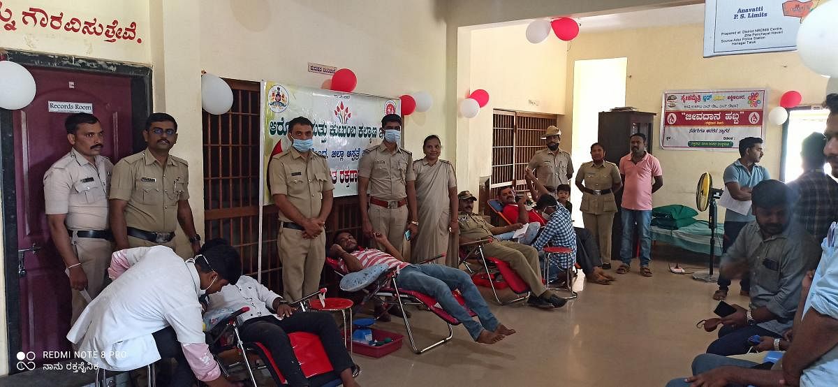 A blood donation camp conducted at a police station in Akkialur. Credit: DH Photo
