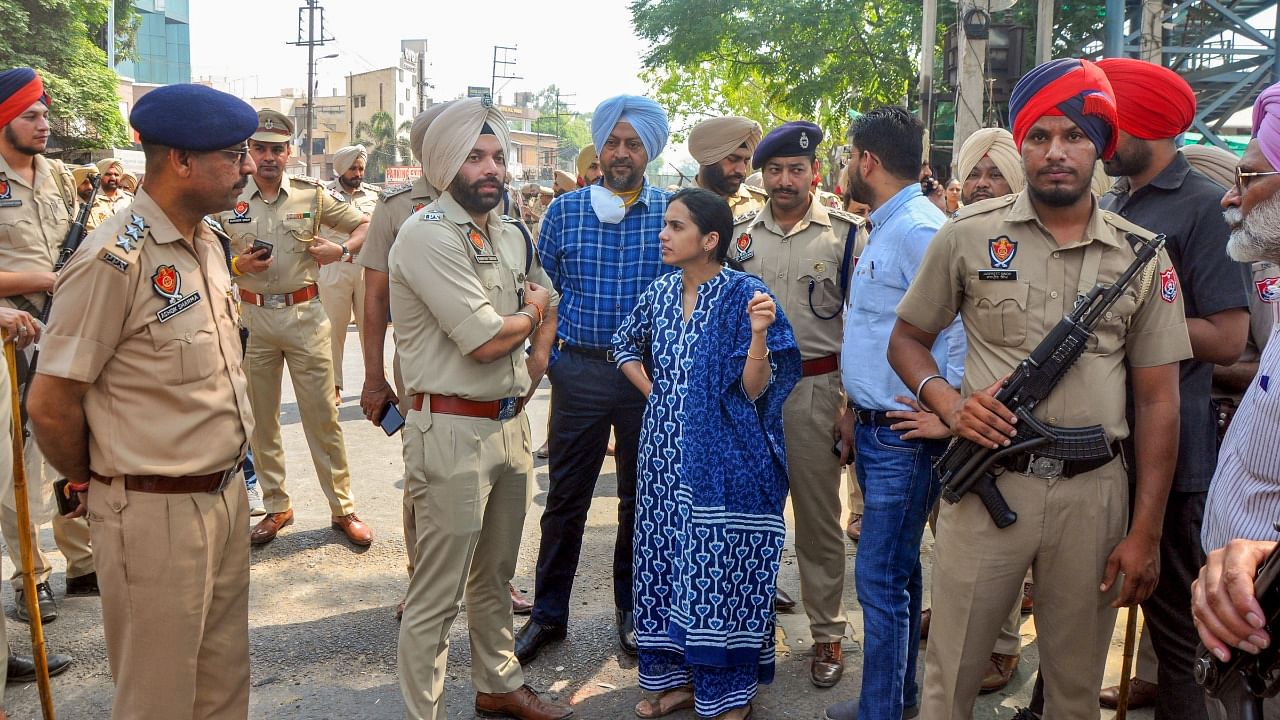 DC Sakshi Sawhney along with SSP Nanak Singh outside Kali Mata temple, a day after clashes broke out between two groups, in Patiala. Credit: PTI Photo