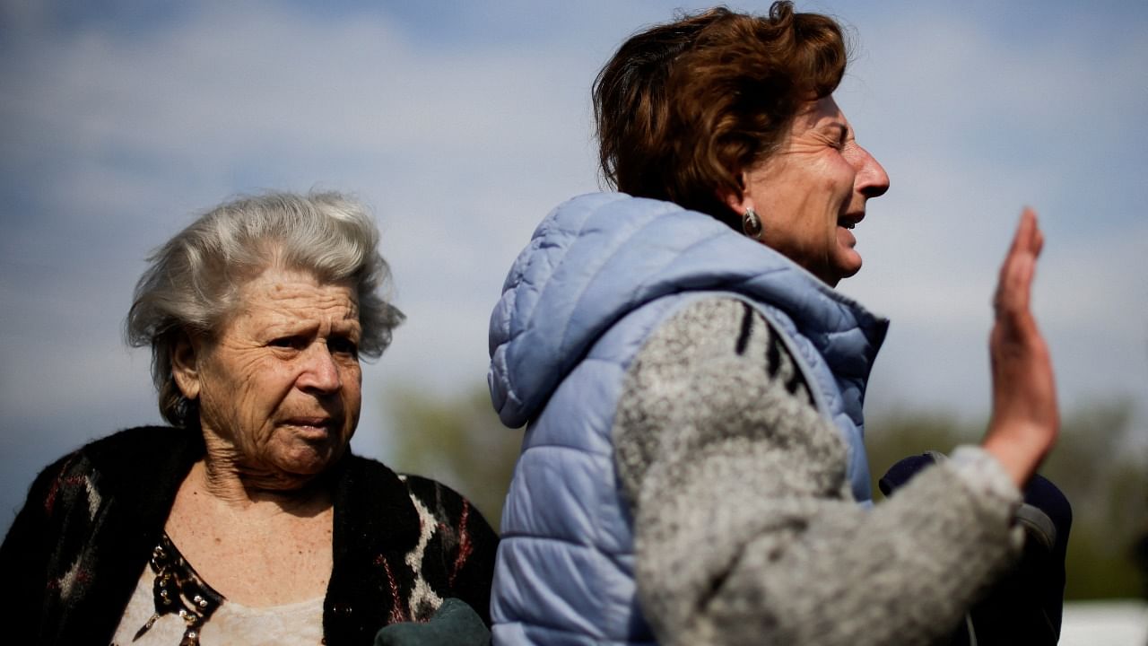 A Ukrainian refugee woman from Mariupol area, cries after arriving at a registration centre for internally displaced people, amid Russia's ongoing invasion of Ukraine. Credit: Reuters Photo