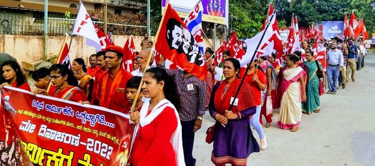 Members of various labour organisations take out a protest rally in Mangaluru.
