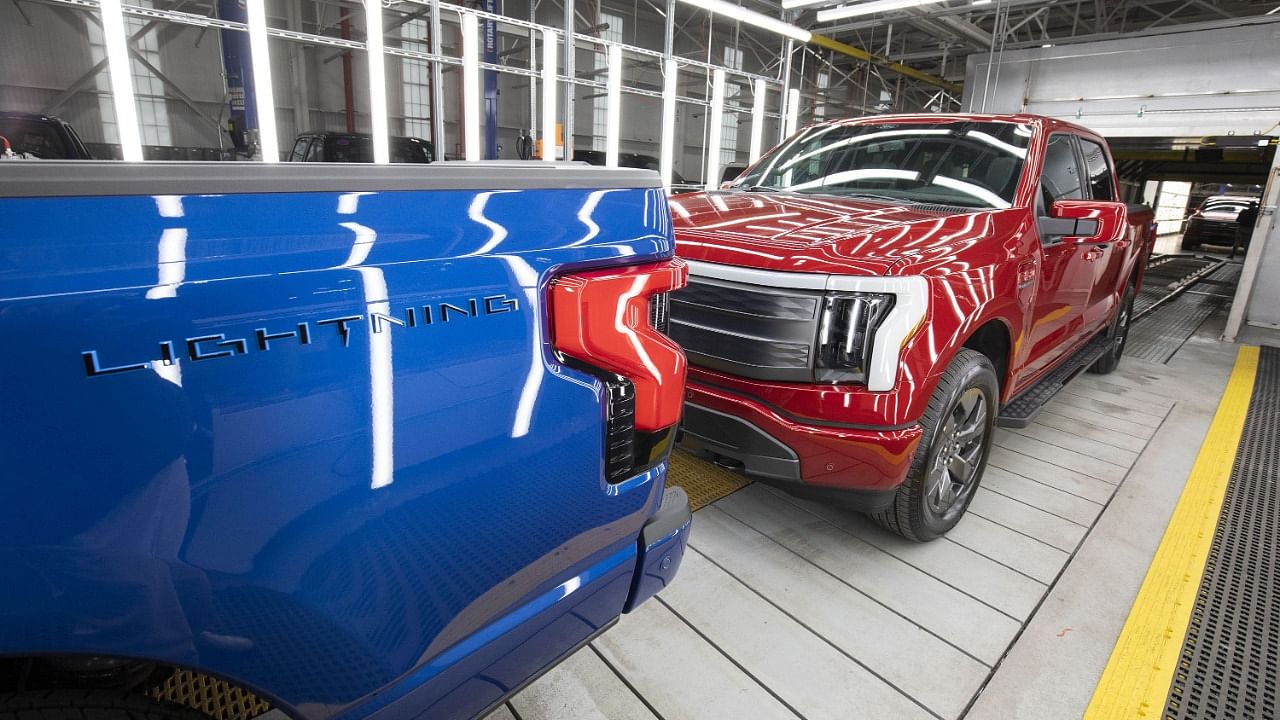 Ford F-150 Lightning pickup trucks are shown at the Ford Rouge Electric Vehicle Center in Michigan. Credit: AFP File Photo