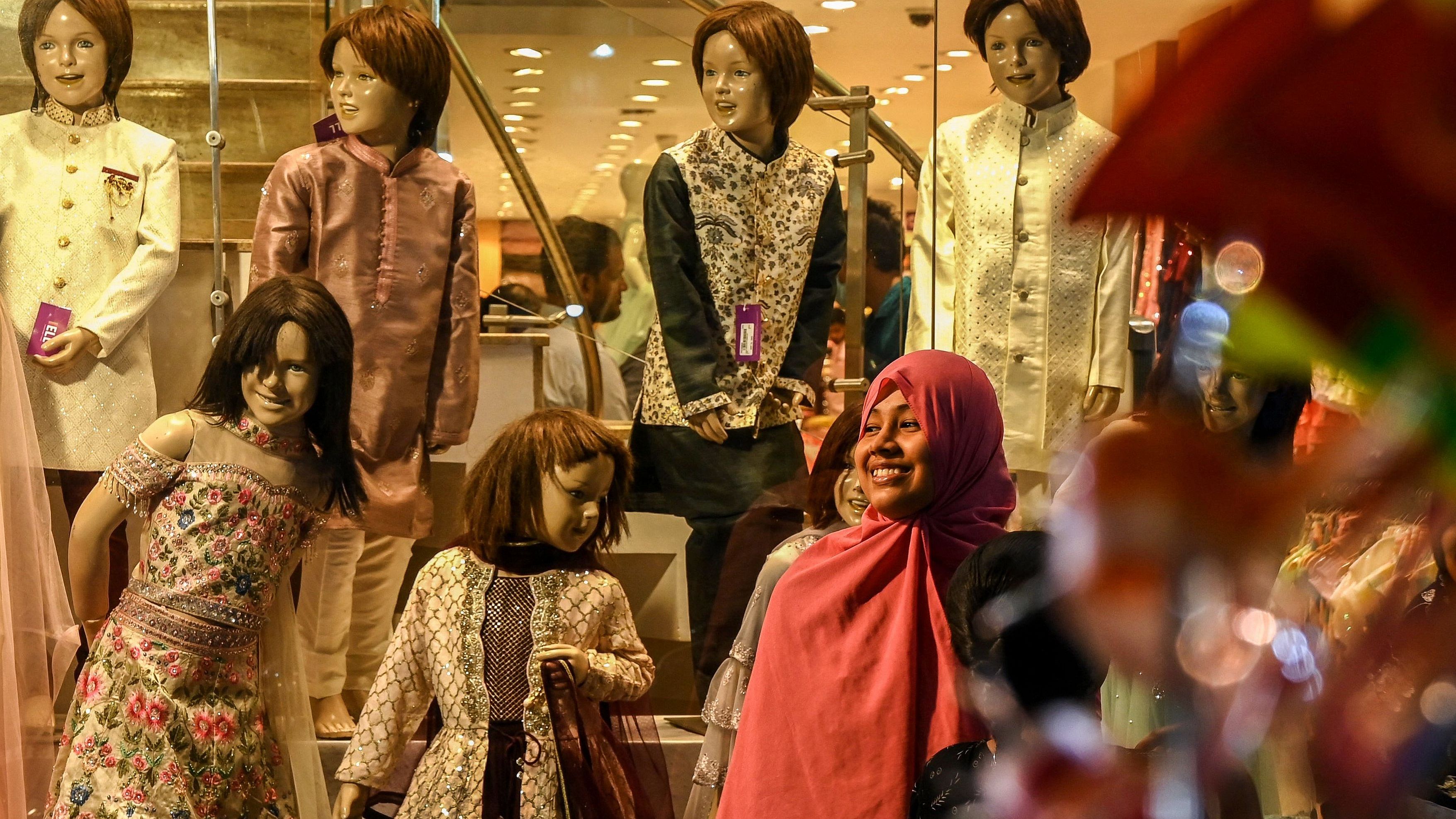 The ritual of shopping, dressing up, and going to relatives' houses for Eidi and treats, has returned. Credit: AFP Photo