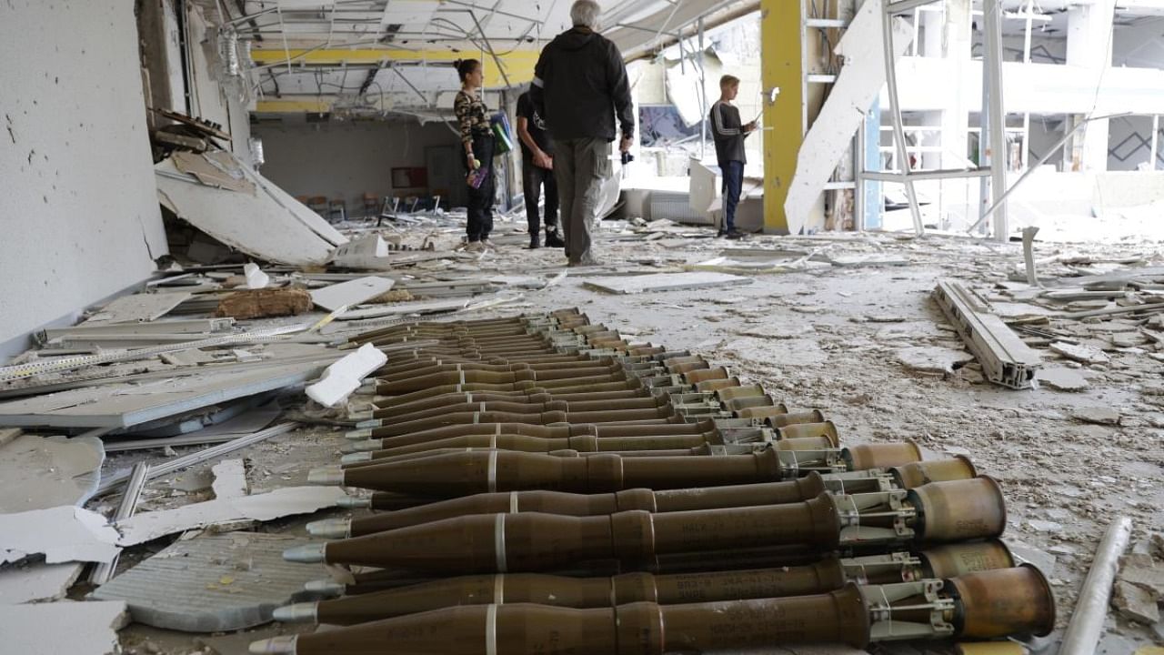 RPG shells lie in the hall of a destroyed school in Mariupol, in territory under the government of the Donetsk People's Republic, eastern Ukraine. Credit: AP/PTI Photo