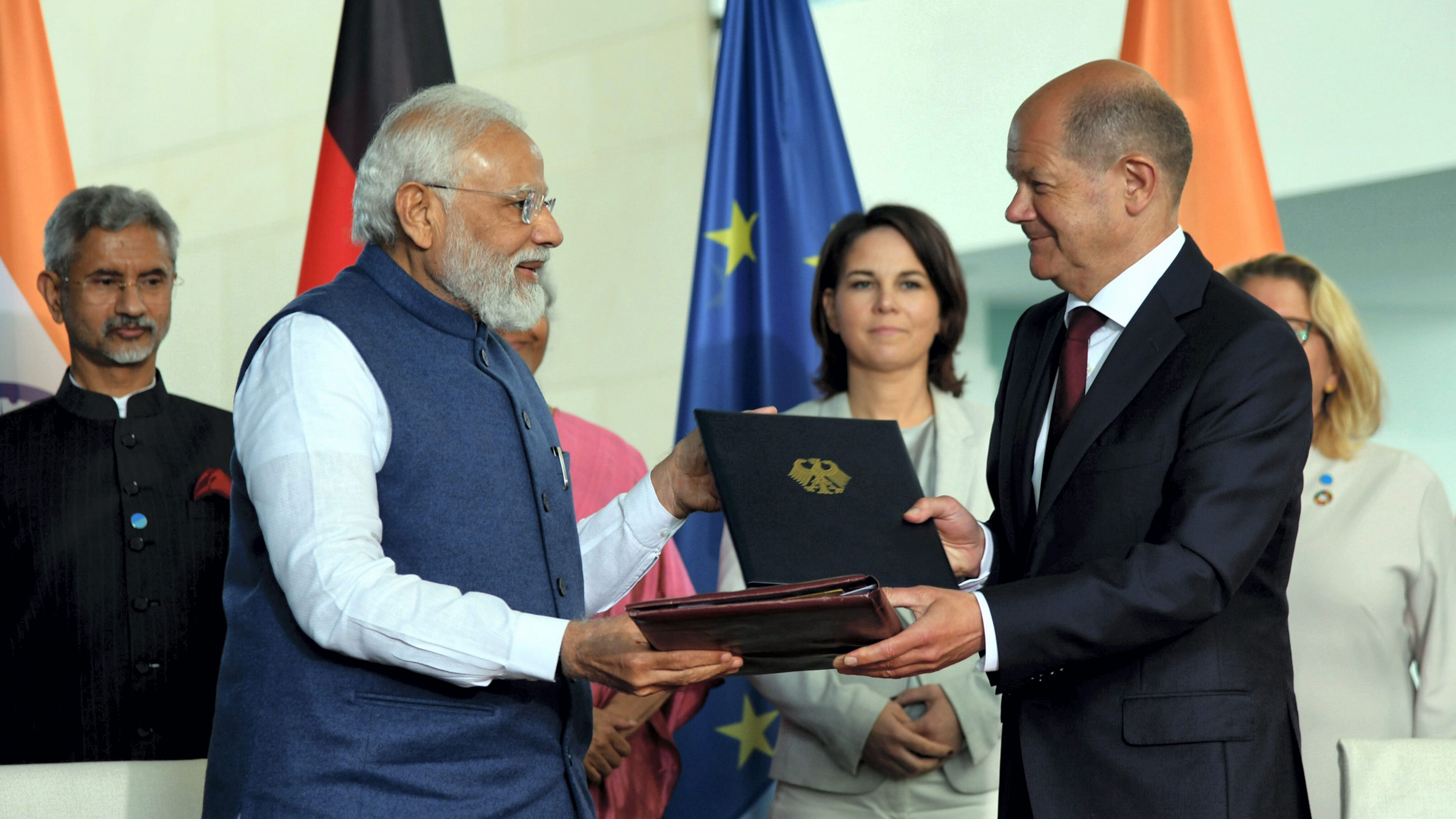 Prime Minister Narendra Modi with Chancellor of Germany Olaf Scholz signing the agreement, during the 6th India-Germany Inter-Governmental Consultations, at Federal Chancellery, in Berlin. Credit: PIB Handout