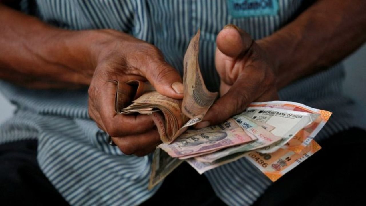 The rupee finally closed at 76.40, registering a rise of 8 paise over its previous close. Credit: Reuters Photo